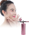 Model using Deep Hydration Oxygen Facial Machine Handheld High Pressure Mist Sprayer For Skin Rejuvenation, Deep Clean, And Moisturizing
