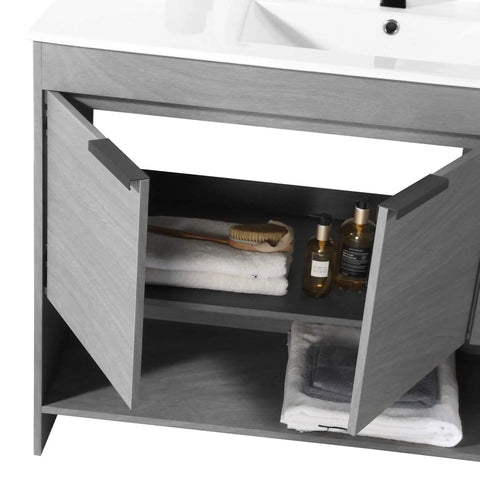 Slick 48 Inch Bathroom Vanity With Built In Sink And Modern Silhouettes Featuring Buttery Smooth Soft Close Doors Spacious Storage Drawers And A Rock Hard Finish Designed For Tiny Baths Requiring Full Assembly, showing open soft-close cabinet with towels and storage.