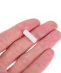 Hand holding a white nylon connector, part of Double Headed Furniture Clips 100 Pack Adjustable Nut Design for cabinet assembly.