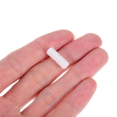Hand holding a white nylon connector, part of Double Headed Furniture Clips 100 Pack Adjustable Nut Design for cabinet assembly.