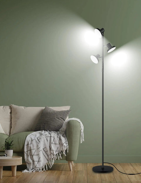 LED Tree Floor Lamp With 3 Adjustable Rotating Heads And Stepless Dimming in a living room with green walls, modern black finish.