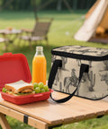 Insulated Lunch Box For Work And On The Go With Leakproof Construction and Removable Shoulder Strap on picnic table, cowboy design