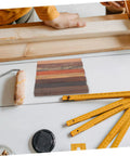 Top Shelf Wood Pen Blanks For Turning 8 Pack Exotic Lumber with sick rotating grain pattern on white table.