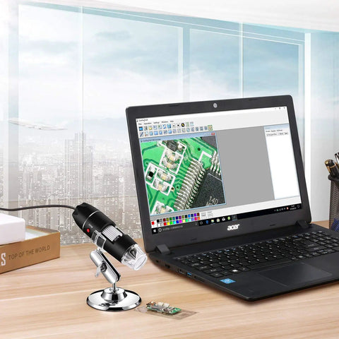 Handheld Digital Microscope 40X To 1000X With 8 LED Endoscope Camera Carrying Case And Solid Metal Stand Compatible With Android Windows 7 8 10 11 Linux Mac Not For iPhone iPad Great For Tiny Details And Gearheads. Black handheld microscope on metal stand beside laptop