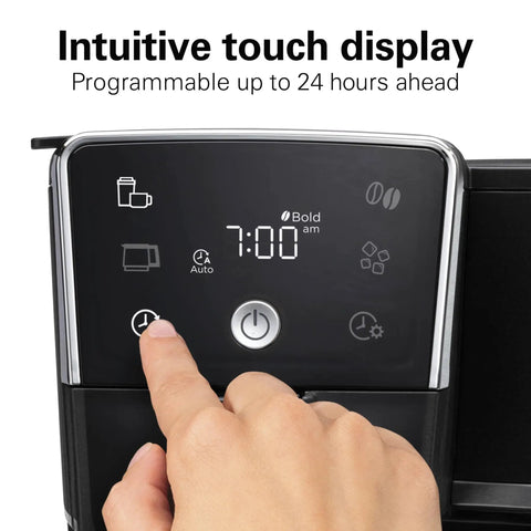 Person using the control panel of Two Way Programmable Drip Coffee Maker For Hot And Iced Brews With Single Serve Option