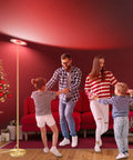 Family dancing near Upgraded LED Floor Lamp With Up Down Lighting, 2000 Lumen, RGBCW 16 Million Color Changing next to a Christmas tree
