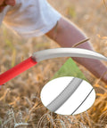Close-up of 2 Pack Harvest Sickle With Plastic Handles, Sawtooth 6.5 Inch Stainless Steel Blade, used in wheat field