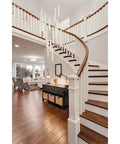 Modern 16 Light Chrome Ceiling Pendant With Glowing Crystal Accents For A Fresh Indoor Setup And Smooth Ambient Flow That Really Upgrades Your Whole House Game Today above a wooden staircase.
