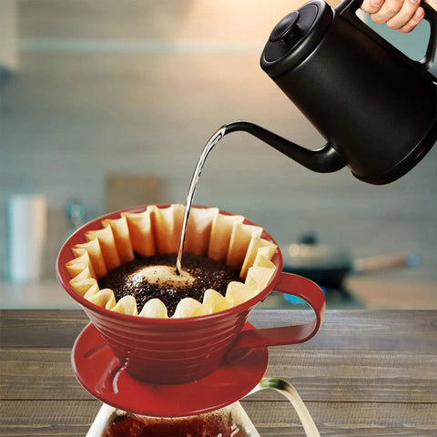 Pouring hot water into coffee dripper with Disposable Coffee Filters For 1 To 4 Cup Basket Makers, Natural Brown Unbleached, 100 Count Pack