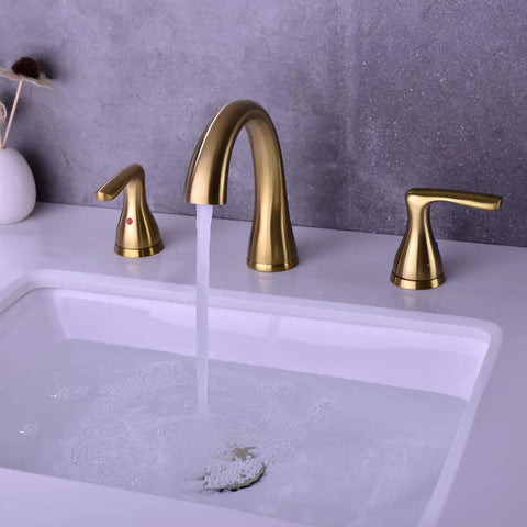 Two-Handle 8-Inch Gold Widespread Bathroom Faucet With Pop-Up Drain running water, brushed gold finish, installed on white sink.