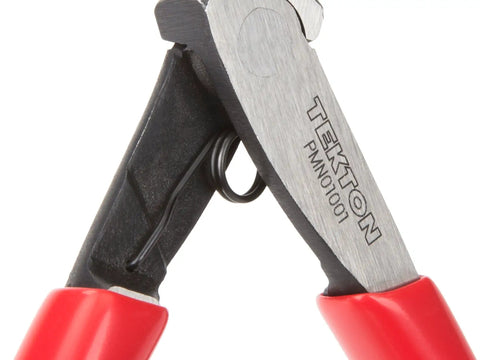 Close-up of red-handled pliers showing the recessed coil spring between jaws, labeled Tekton, for precision grips and control.