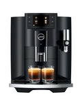 Next Level One Touch Automatic Coffee Maker In Slick Piano Black Finish Featuring Fresh Bean Grinding And Up To Seventeen Custom Drink Options For Home Setups Easy Peasy Controls Serve Up Straight Fire Espresso Every Single Day, displaying two espresso shots.