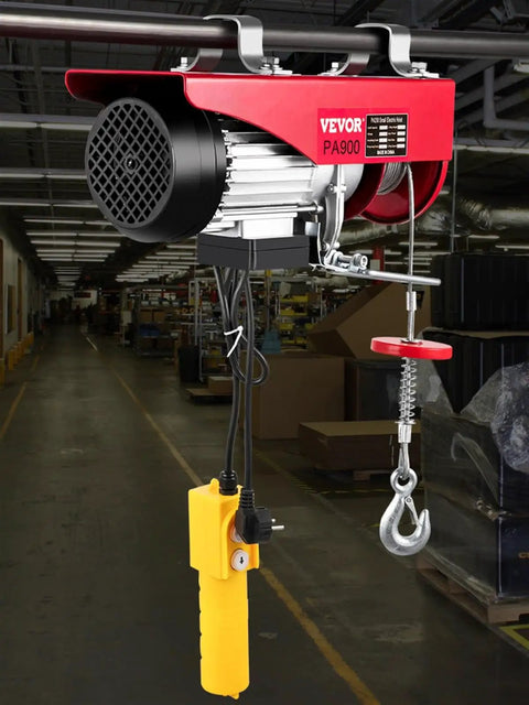 Heavy Duty 2000 Lbs Electric Hoist Crane With 39 Foot Wire Rope Wired Remote Control showing motor and remote in a workshop.