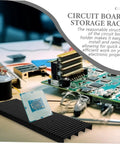 Anti Static Circuit Board Holder And PCB Storage Rack on a desk with circuit board and tools for electronic projects