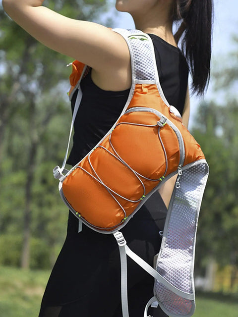 Woman wearing Women Hydration Vest Backpack For Running Hiking Cycling And Climbing Ultralight Water Bladder Pack In Orange One Size