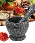 Heavy Duty Unpolished Granite Mortar And Pestle Set For Home Kitchen Grinds Guacamole Salsa Spices And Nuts Like A Pro Durable Stone Grinder Bowl For Crushing Flavor on a counter with spices and herbs