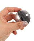 Hand holding Two Pack Stainless Steel Door Stoppers No Drill Easy Install Punch Free Hemispherical Anti Collision Silver Door Stop