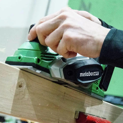 Hand using 18V MultiVolt Cordless Hand Planer With Three And A Quarter Inch Cutting Width Tool Only No Battery 16,000 RPM No Load Speed 5/64 Inch Planing Depth Great For Quick Wood Surfaces And Trim Projects on wood