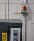 Beefy Enclosed Mountable Motor Disconnect Switch For Heavy Duty Machinery 3 Pole 25A 600V IP66 NEMA 4X on wall next to equipment