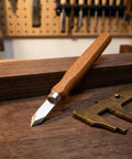 Six Pack Heavy Duty Woodworking Marking Knives With High Carbon Steel Blades and Dual Bevel Heads placed on walnut wood surface.