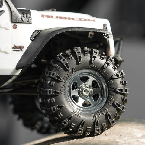Close-up of 36x14mm 0.7 Inch Swamp Claw RC Tires For 1/30 Axial SCX30 with Soft Sticky S5 Compound on rocky terrain.