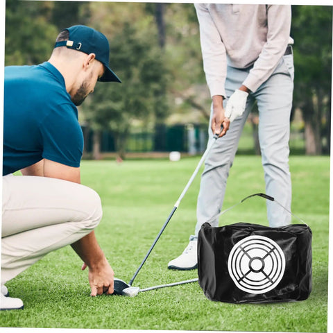 Golf Swing Trainer Bag Impact Hitting Bag For Indoor And Outdoor Practice in use during golf lesson on grass field