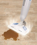 Genuine OEM PowerFresh Steam Mop cleaning spill with mop pad and fragrance disc on tile floor for Symphony All-In-One.