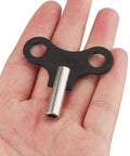 Hand holding Two Pack 4.5mm Clock Winding Keys For Antique Wall Clocks And Alarm Clocks, Durable Steel Winder Set With 0.177 Inch Hole