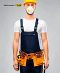 Construction worker wearing yellow hard hat, safety mask, and tool belt.