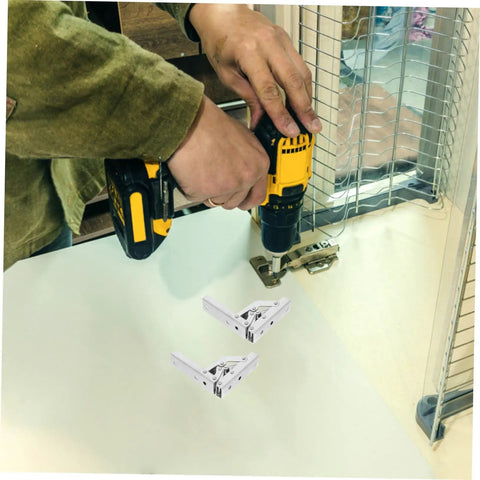Person installing 4 Pack 90 Degree Folding Cabinet Door Hinges For Corner Cabinets, Hidden Soft Close Brackets with drill