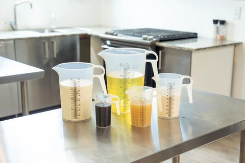 32oz One Quart Measure Pitcher With Conversion Chart, Extra Strong Food Grade Polypropylene, BPA Free, Microwave And Dishwasher Safe, Translucent Easy Pour Design For Cooking, Home Hobbies, Oils And Fluids, Spa Chemicals on counter