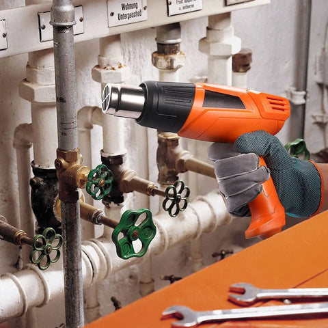 Powerful 1500W Dual Temperature Heat Gun With 350C And 550C Settings in use on pipe fittings, ergonomic grip, concentrated hot air