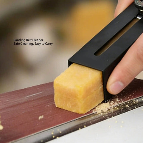 Pro Grade Natural Rubber Sandpaper Cleaning Stick in use on sanding belt with stainless steel tip visible