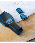 Pro Grade Stud Finder Wall Scanner And Metal Detector With Intuitive Radar Tracking Bang On Target Accuracy on a blueprint.