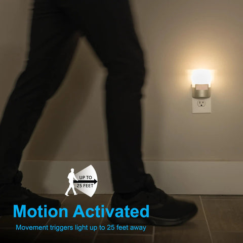 Motion Sensor Night Light Plug In 40 Lumens Soft White LED Nightlight UL Certified Energy Efficient No Fuss Auto On When Motion Detected Ideal Nightlight for Bedroom Bathroom Kitchen Hallway 2 Pack Silver Model 46633 in use as a person walks by.
