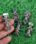 stainless steel hex bolt kit with nuts and washers on green background