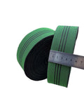 Hella Tough One Point Eight Inch Latex Upholstery Webbing Repairs Sagging Couch And Chair Seats Stops Bottoming Out With Solid Rubber Stretch Reliable For Hammocks And Fast DIY Household Fixes in green and black with a ruler for size.