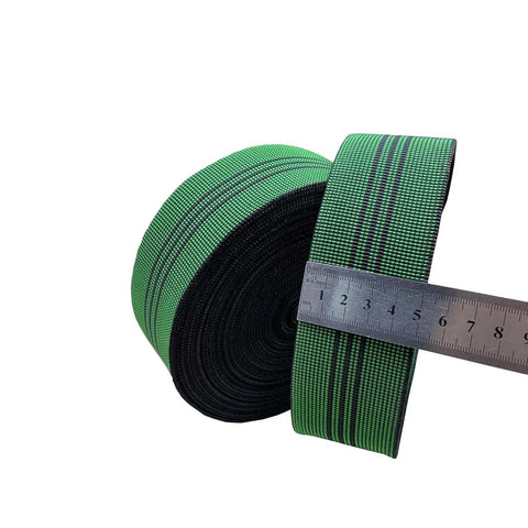 Hella Tough One Point Eight Inch Latex Upholstery Webbing Repairs Sagging Couch And Chair Seats Stops Bottoming Out With Solid Rubber Stretch Reliable For Hammocks And Fast DIY Household Fixes in green and black with a ruler for size.