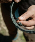 Tacana ANSI Z87.1 Safety Glasses for Men With Anti Fog Lenses being adjusted outdoors for a secure fit and comfort.