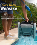 Person removing Nautilus CC Automatic Robotic Pool Cleaner With Wall Climbing Scrubber And Top Load Filter Access from pool