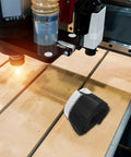 Boss Level Cnc Vacuum Dust Brush helps kick sawdust and chunky wood chips from router spindle on CNC table.