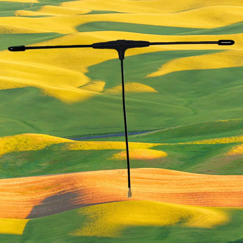 915MHz FPV Antenna 90mm ELRS Ready For EP1 RX IPEX1 Compatible With TBS Tracer RC FPV Drone Part over landscape