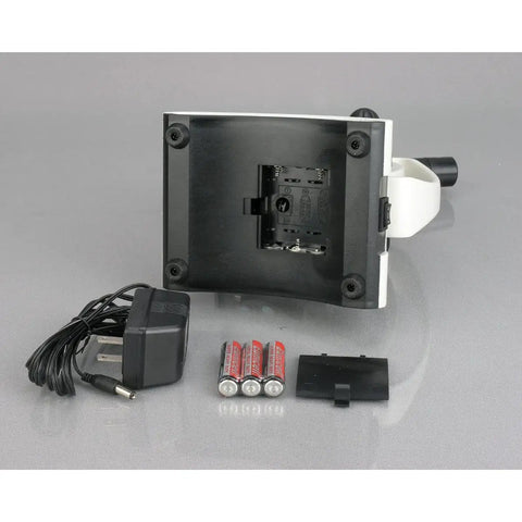 Cordless Compound Monocular Microscope with power adapter and batteries, back view showing battery compartment