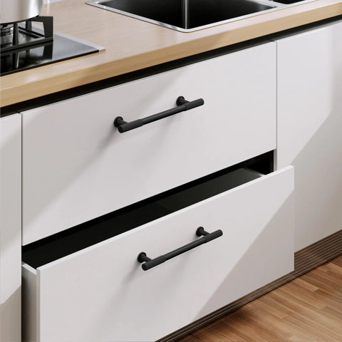 Matte Black Cabinet Pulls 5 Inch Center To Center Zinc Alloy Kitchen Handles on white drawers, installed in modern kitchen setting