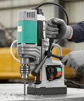 Portable Magnetic Drill Press With 2923 Lbs Electromagnetic Base in use, showing drilling process on metal surface.