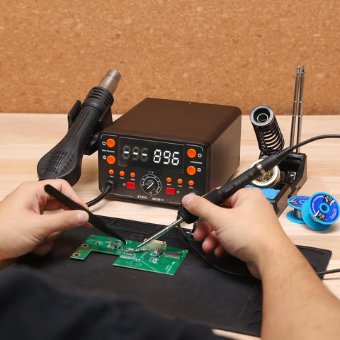 Person using Two In One Hot Air Soldering And Rework Station With T12 Tip System For Electronics, Fast Heat Up In Seconds, Large Display.