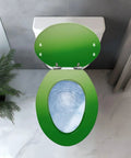 Top view of green Elongated Toilet Seat Resin on a toilet with visible bowl and bathroom decor.