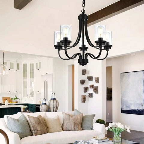 Affordable Luxury Five Light Farmhouse Chandelier In Classic Black Finish hanging in a modern living room with clear glass shades.