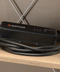 Portable EV Charger with 12 Amp Output, 25 Ft Rugged Cable, SAE J1772 Connector on shelf
