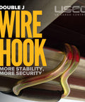 Close-up of double J wire hook on heavy duty 2 inch 18 foot ratchet straps 13000 lbs break strength, secure tie downs on a trailer.